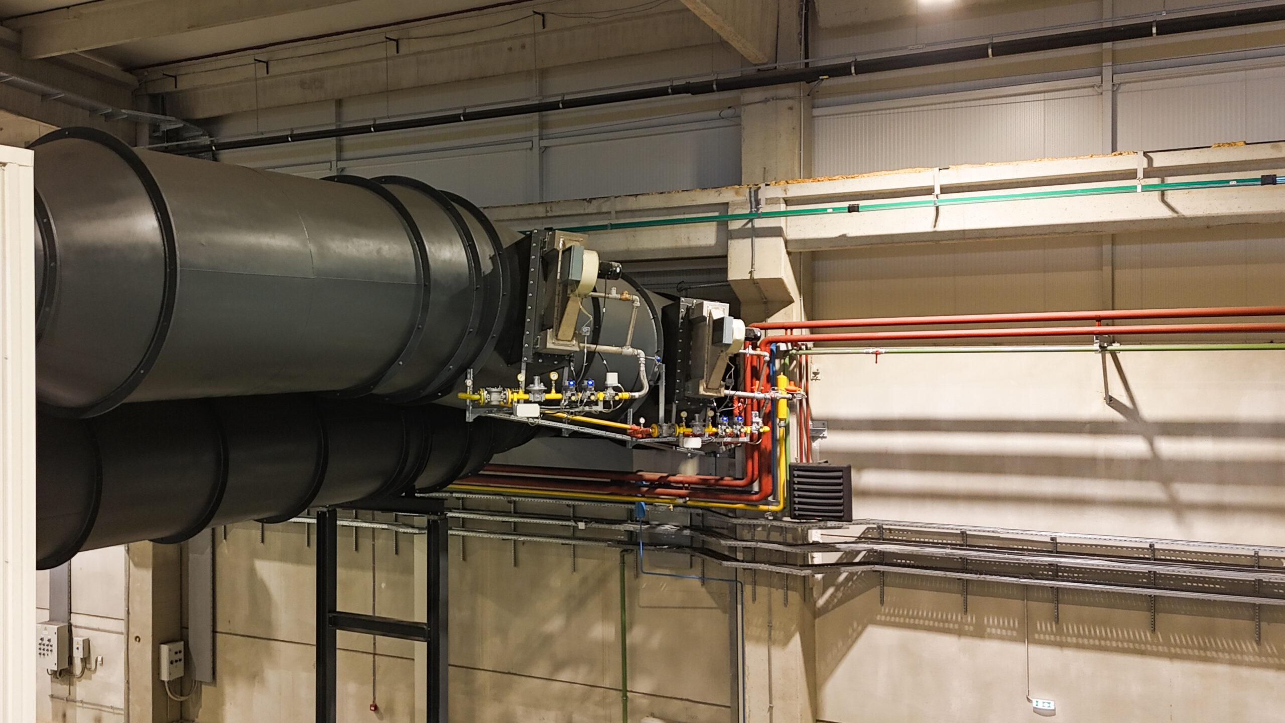Burner integrated into dust extraction system